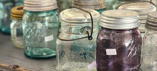 Antique glassware and jars  at First Monday